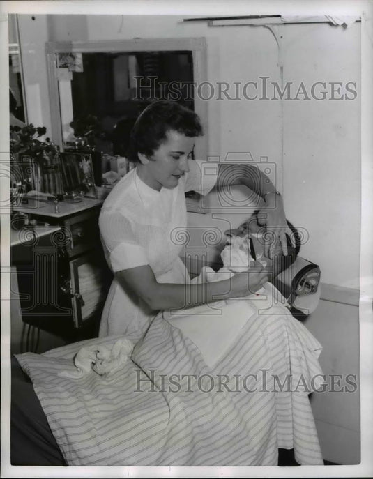 1956 Press Photo Ruth Sakovich smooth shaves John Dineen - nee26961 - Historic Images
