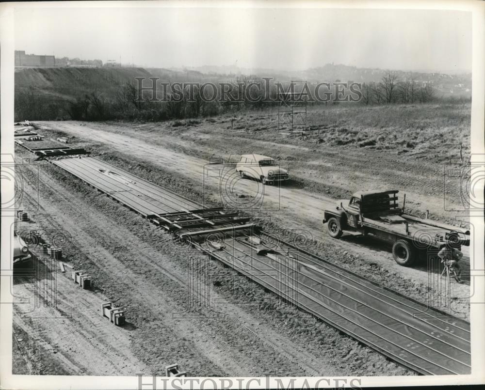 1957 Press Photo Workmen in process of building a road - Historic Images