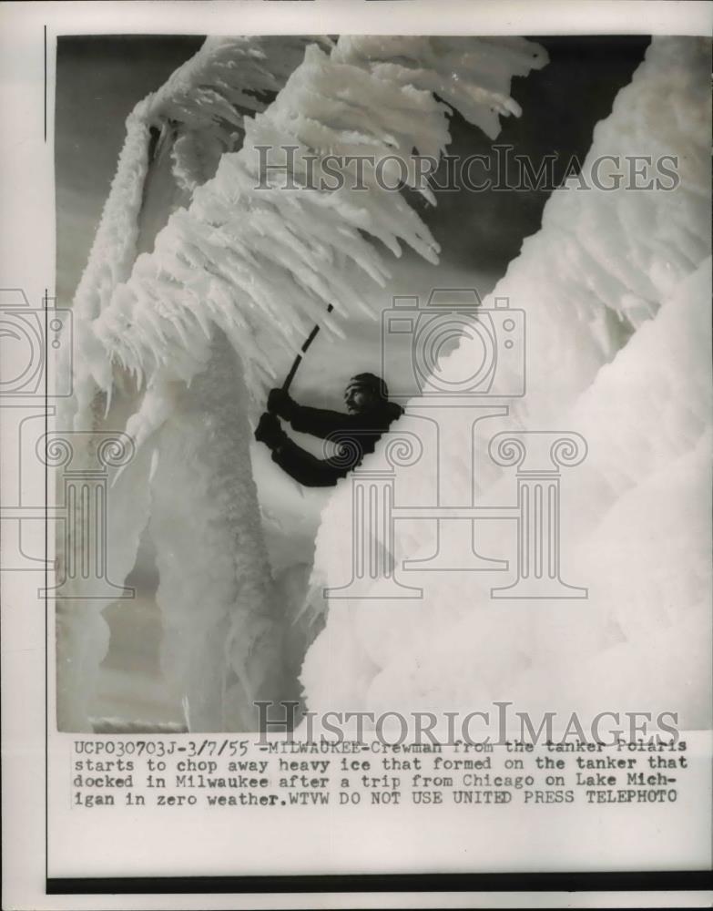 1955 Press Photo A crewman from the tanker Polaris chops off the ice formation - Historic Images