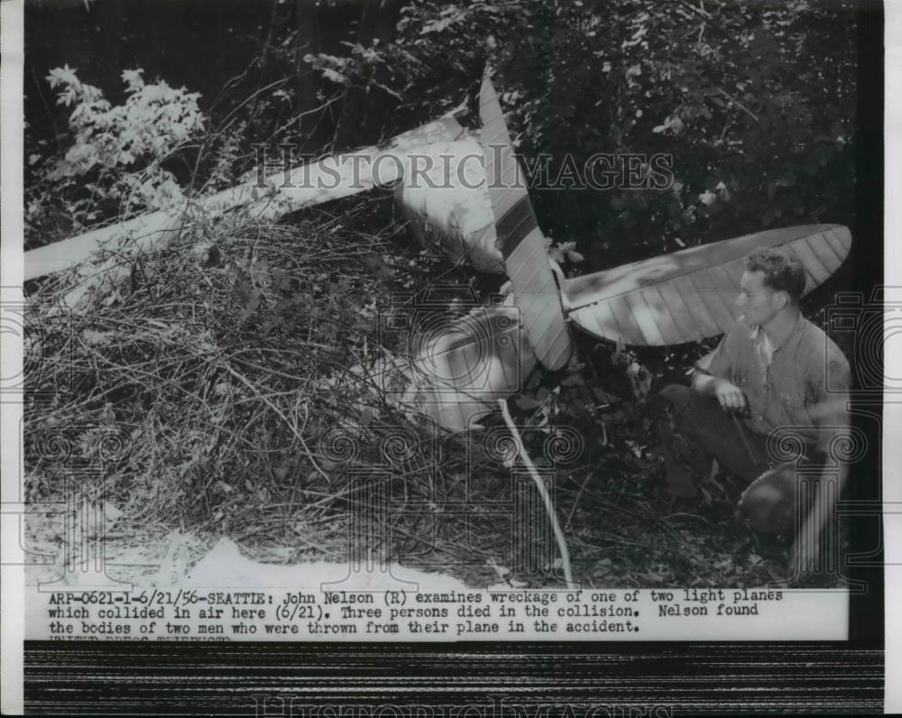 1956 Press Photo John Nelson Examines Wreckage of Plane Crash in Seattle - Historic Images