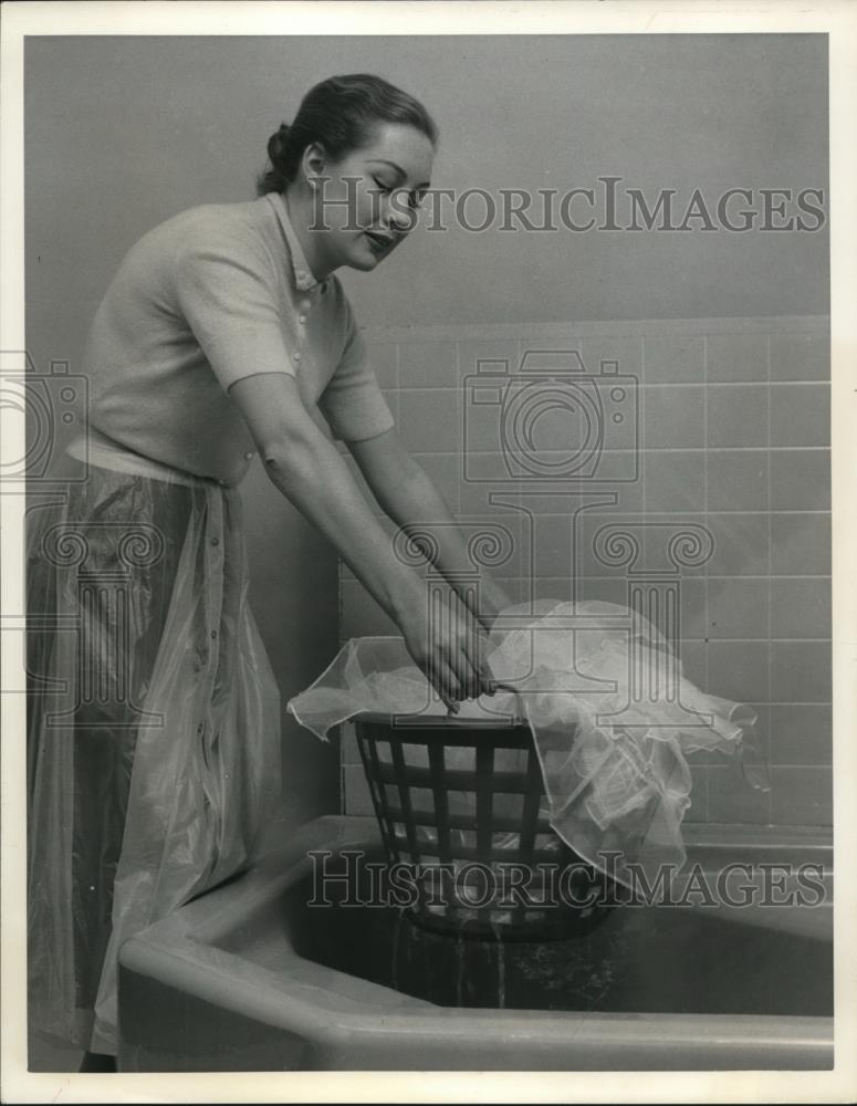 1957 Press Photo Plastic Laundry Basket - nee33371 - Historic Images