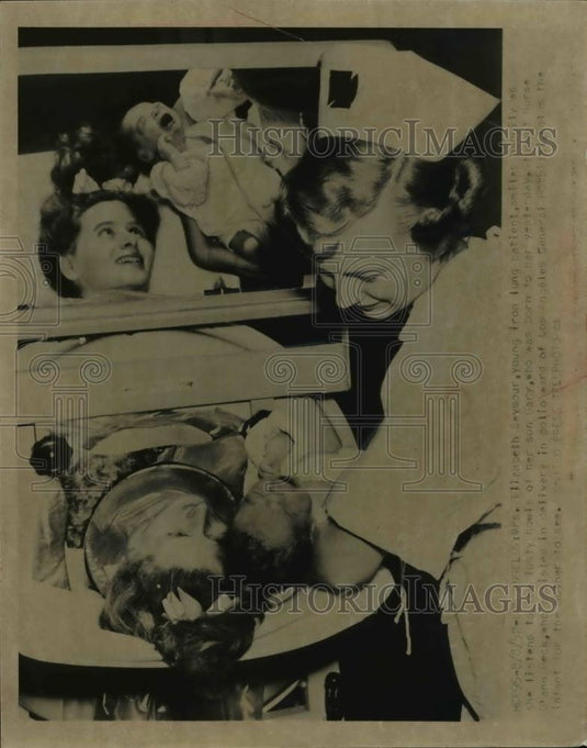1952 Press Photo Elizabeth Seymour Iron Lung Patient Listens to Newborn Son Gary - Historic Images