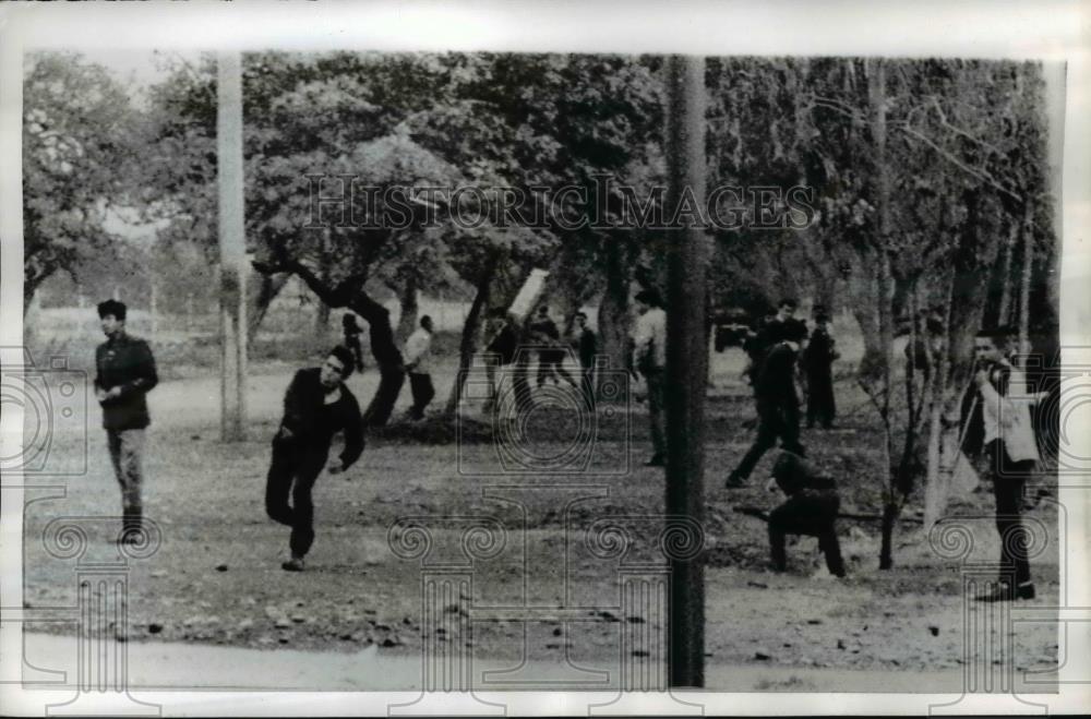 1969 Press Photo Students Throw Stones at Police During Riot, Lima Peru - Historic Images