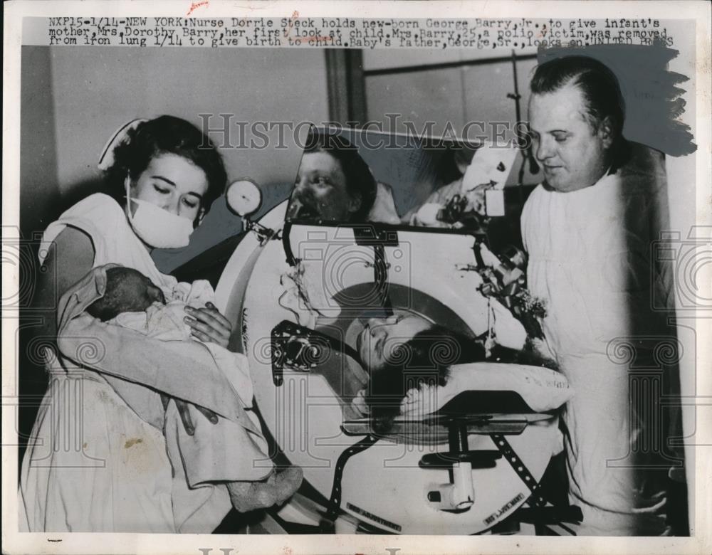 1953 Press Photo Nurse Dorrie Steck holds newborn George Barry Jr. - Historic Images