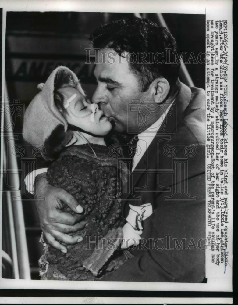 1957 Press Photo Joseph Lahood kisses his blind and paralyzed daughter, Dixie - Historic Images