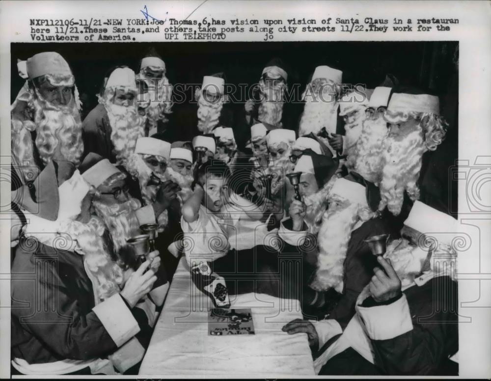 1956 Press Photo Boy Surrounded by Santa Clauses, New York - Historic Images