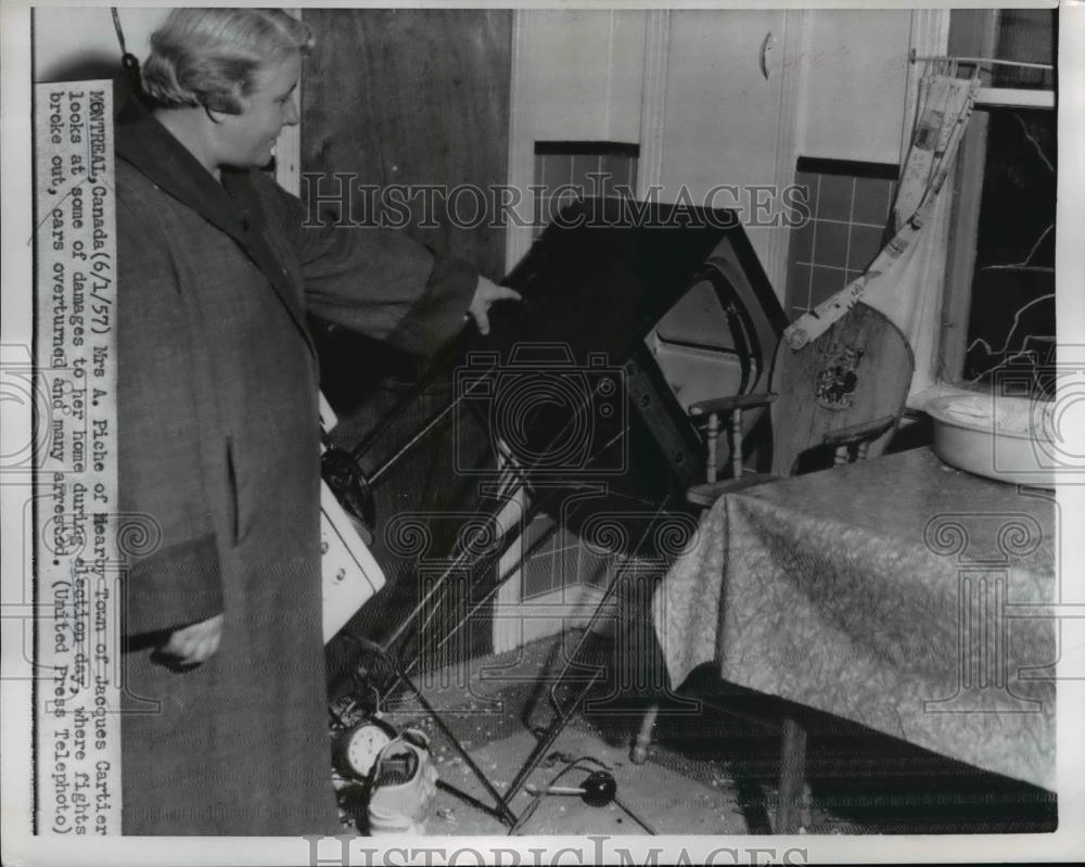 1957 Press Photo Mrs. A. Piche near Jacques Cartier looked at the damages - Historic Images