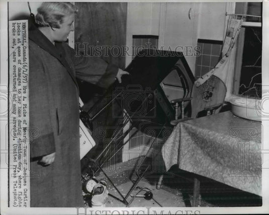 1957 Press Photo Mrs. A. Piche near Jacques Cartier looked at the damages - Historic Images