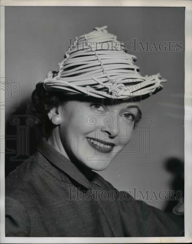 1953 Press Photo of Emile Scofield modeling the latest fashion in hats. - Historic Images