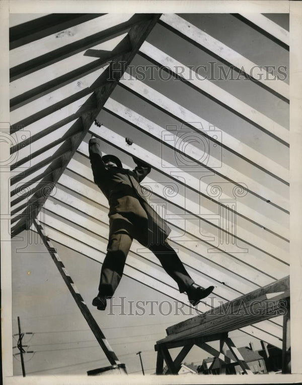 1946 Press Photo Man setting rafters on a new framework construction ...