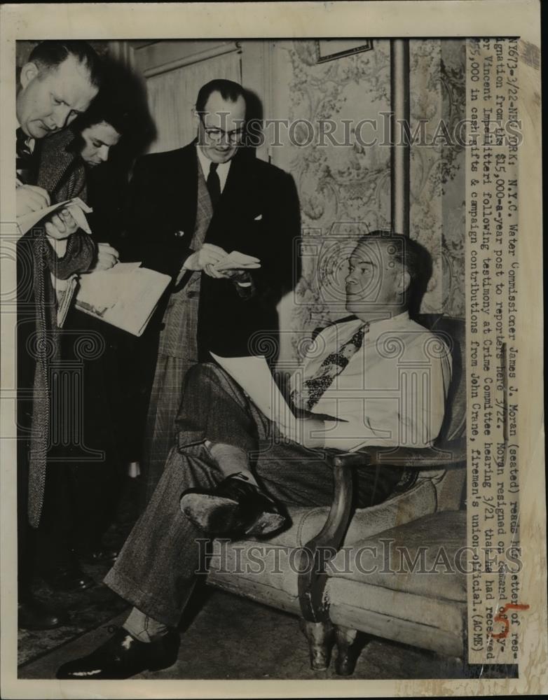 1951 Press Photo NYC Water Commissioner James J Moran reads resignation letter. - Historic Images