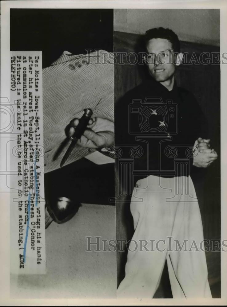 1951 Press Photo Des Moines Iowa John A Masterson wrings his hands after arrest. - Historic Images