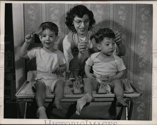 1949 Press Photo Mother Tends to Twin Sons - Historic Images