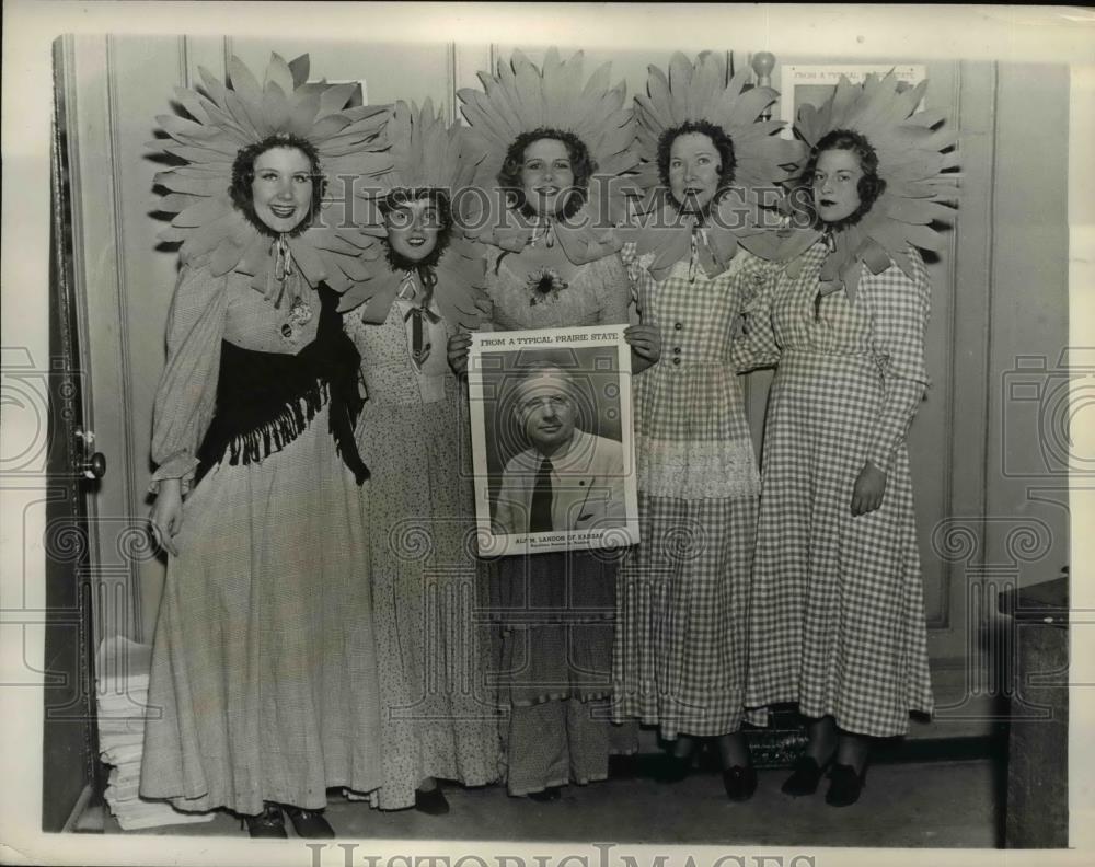 1936 Press Photo of Girls with sunflower hats at the Mid-Town Headquarters. - Historic Images