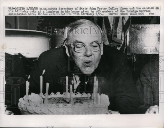 1958 Press Photo Secy. Of State John Foster Dulles Blows Out Candles On Cake - Historic Images