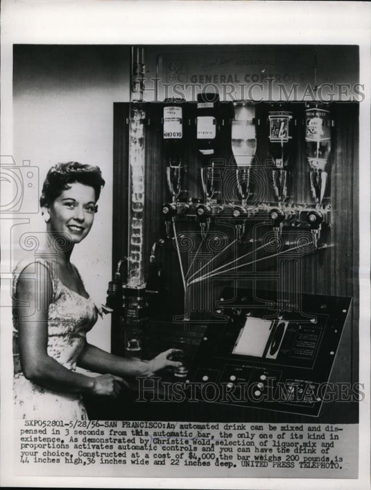 1956 Press Photo San Francisco Christie Wold demonstrates automated bar. - Historic Images