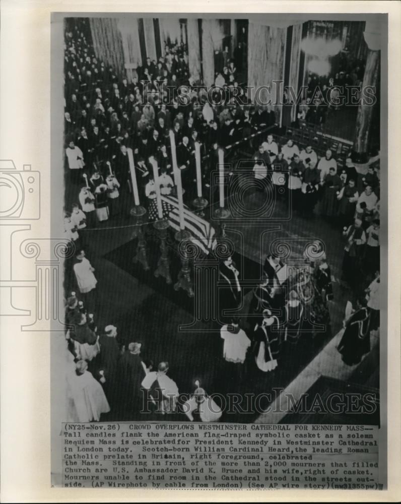 1963 Press Photo Tall candles flank the American flag-draped symbolic casket - Historic Images