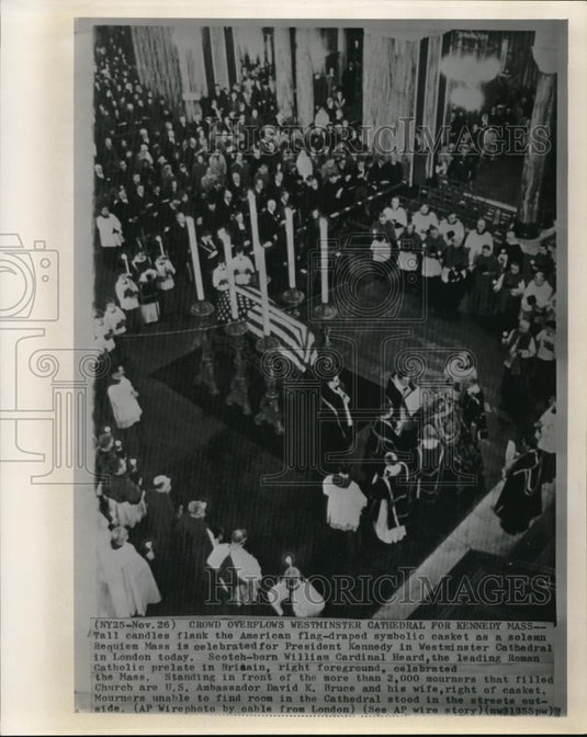 1963 Press Photo Tall candles flank the American flag-draped symbolic casket - Historic Images
