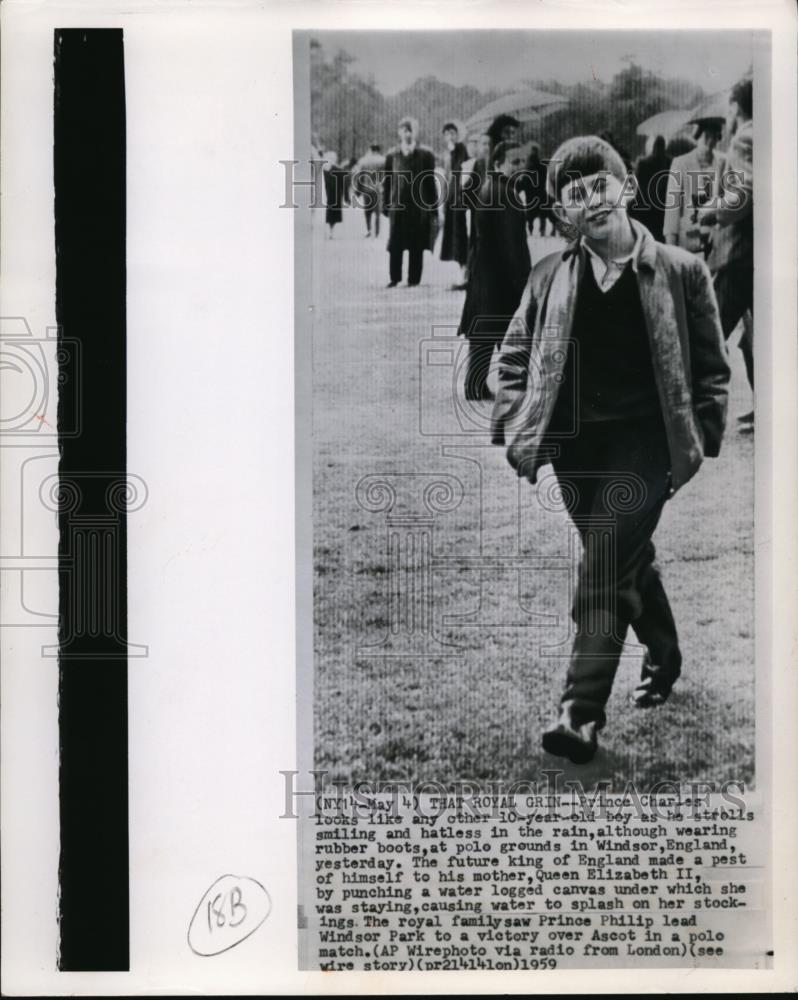 1959 Press Photo Prince Charles strolls at the pole grounds in Windser, England - Historic Images