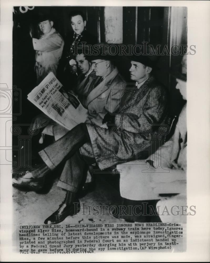 1948 Wire Photo Grim-Visaged Hiss ignores News Headlines - cvw02852 - Historic Images