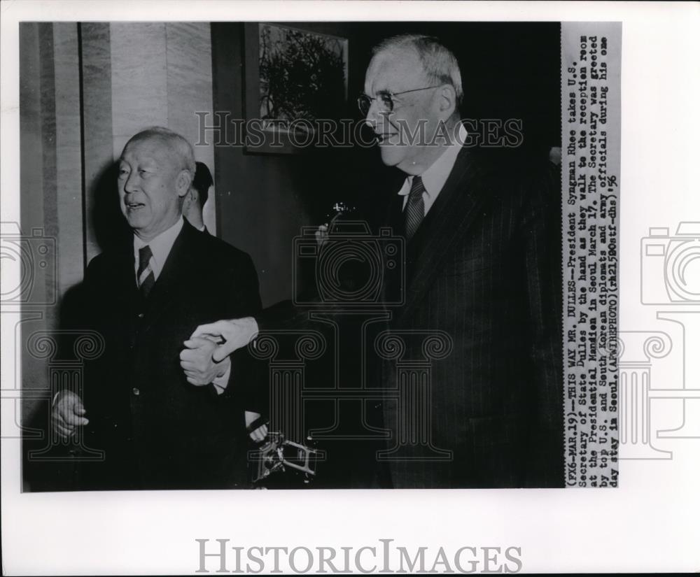 1956 Wire Photo President Syngman takes U.S Secretary of State Dulles by the - Historic Images