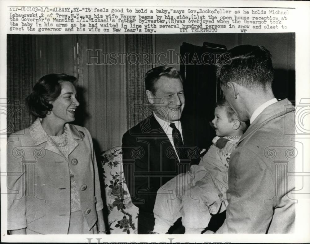 1964 Press Photo It feels good to hold a baby says Gov Rockefeller - Historic Images