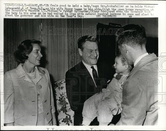 1964 Press Photo It feels good to hold a baby says Gov Rockefeller - Historic Images