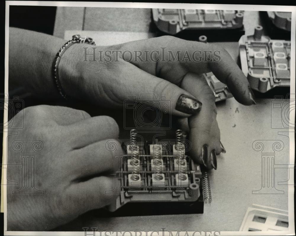 1963 Press Photo Button, Springs cover and Dial mounting plated for Telephone. - Historic Images