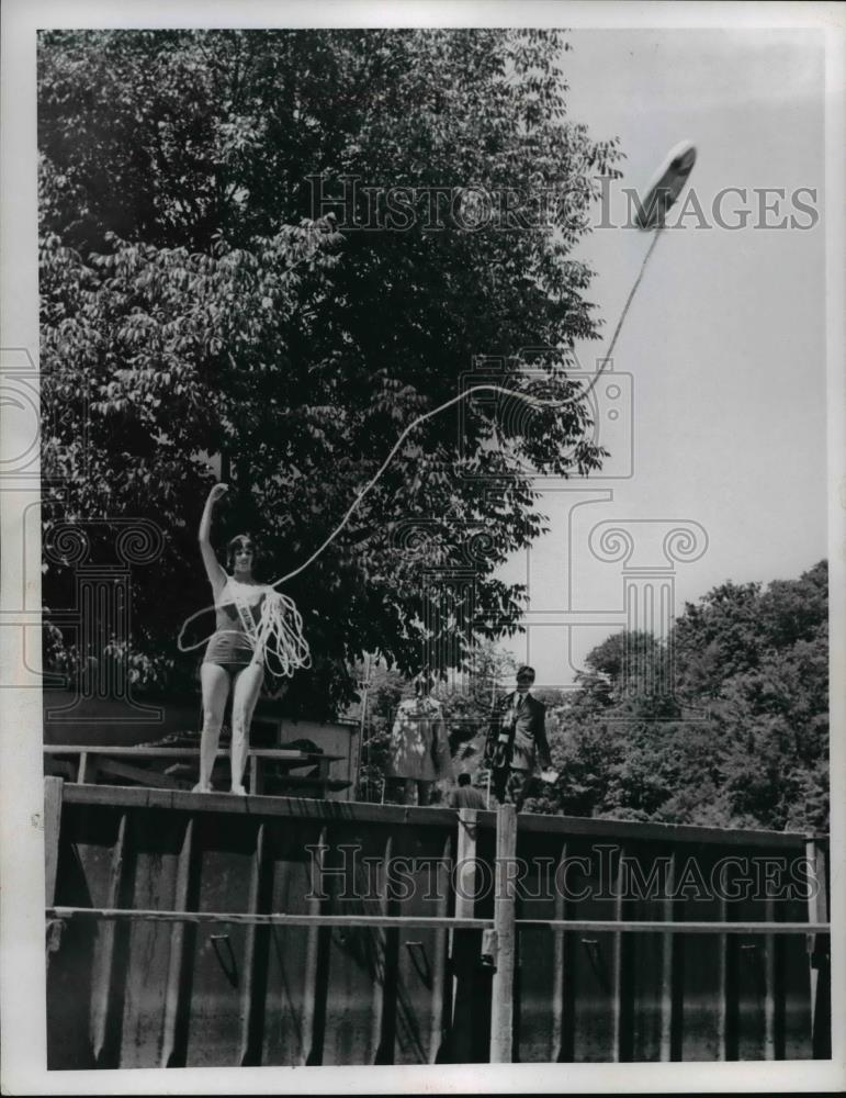 1965 Press Photo Lady Throws A Life Preserver To A Drowning Prson - Historic Images