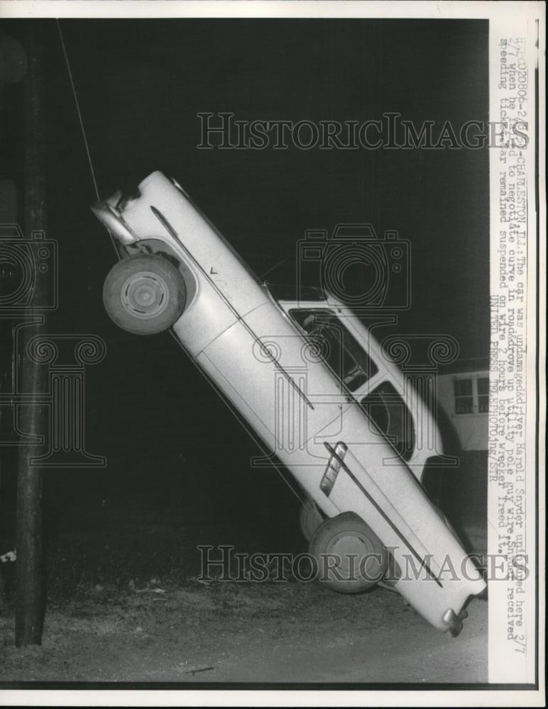 1958 Press Photo Charleston Ill.-Car suspended on wire. - Historic Images