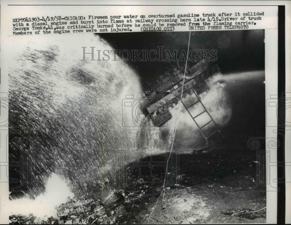 1958 Press Photo Firemen Pour water on overturned gasoline truck Chicago - Historic Images