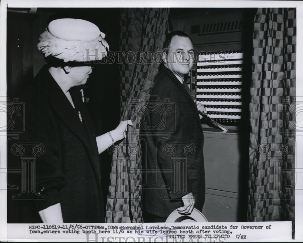 1956 Press Photo Herschek Lovaless entes voting Bootd with his wife. - Historic Images