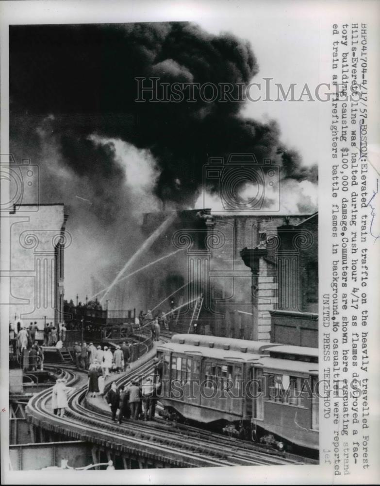 1957 Press Photo Boston fire at building along Forest Hills Everett rr lines - Historic Images