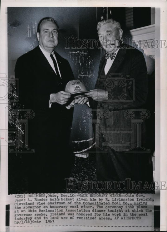1963 Wire Photo Rhodes holds helmet given by Ireland at Ohio Reclamation Assoc. - Historic Images