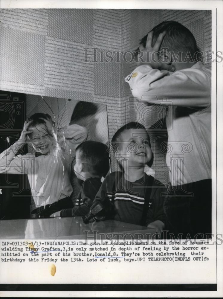 1959 Press Photo Boy Scaring Little Brother in Cracked Mirror - Historic Images