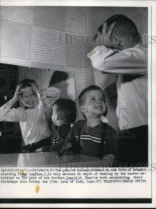 1959 Press Photo Boy Scaring Little Brother in Cracked Mirror - Historic Images