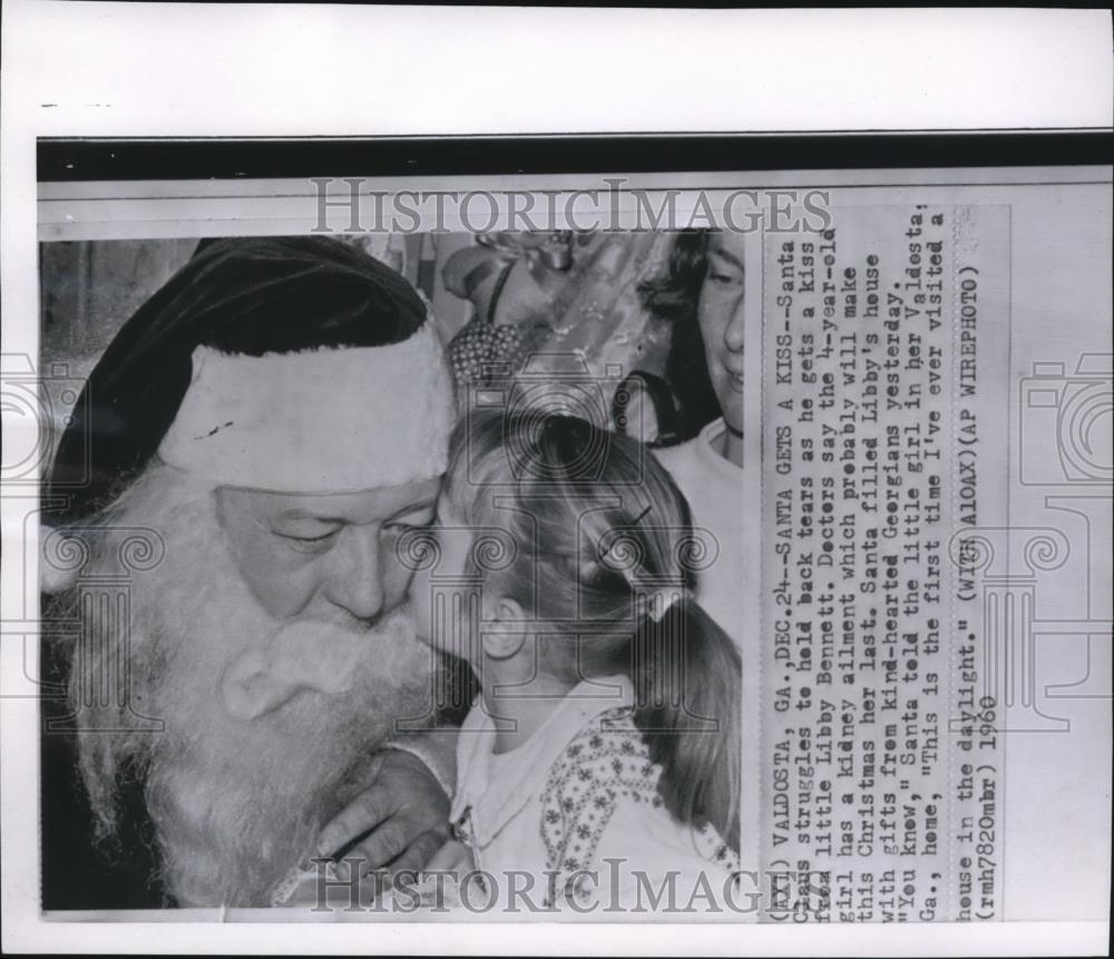 1960 Wire Photo Little Libby kiss Santa Claus with a kidney ailment - cvw06063 - Historic Images