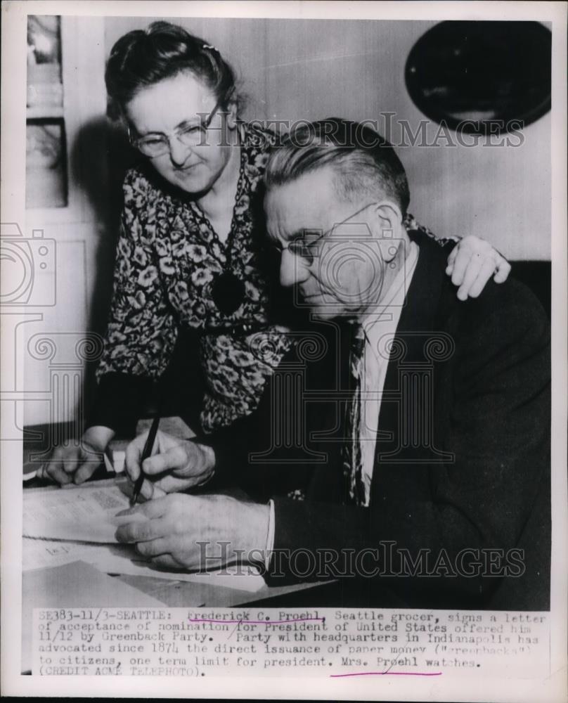 1951 Press Photo Seattle Frederick C Proehl signs letter of acceptance. - Historic Images