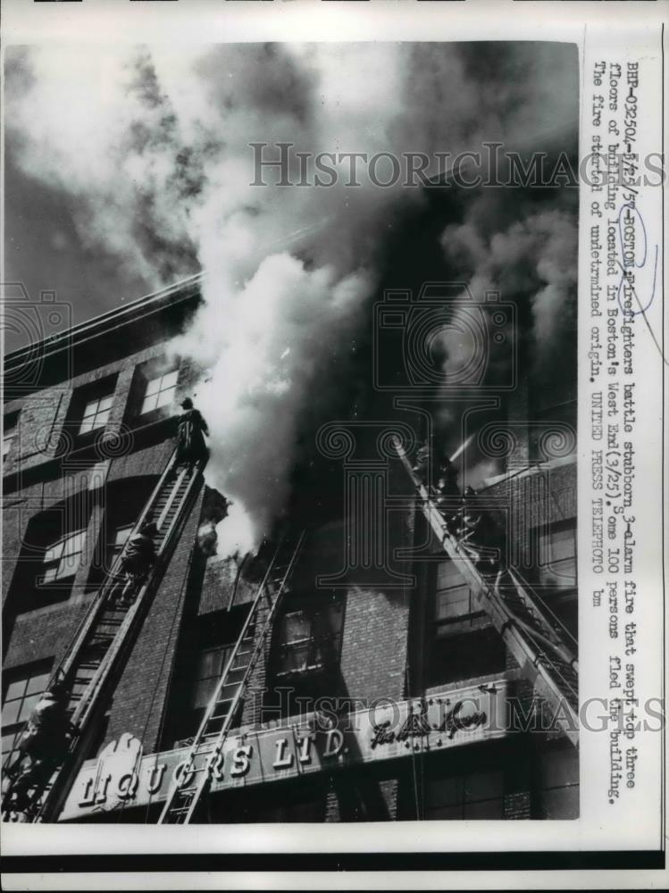 1957 Press Photo Boston firemen battle blaze in West End area - Historic Images