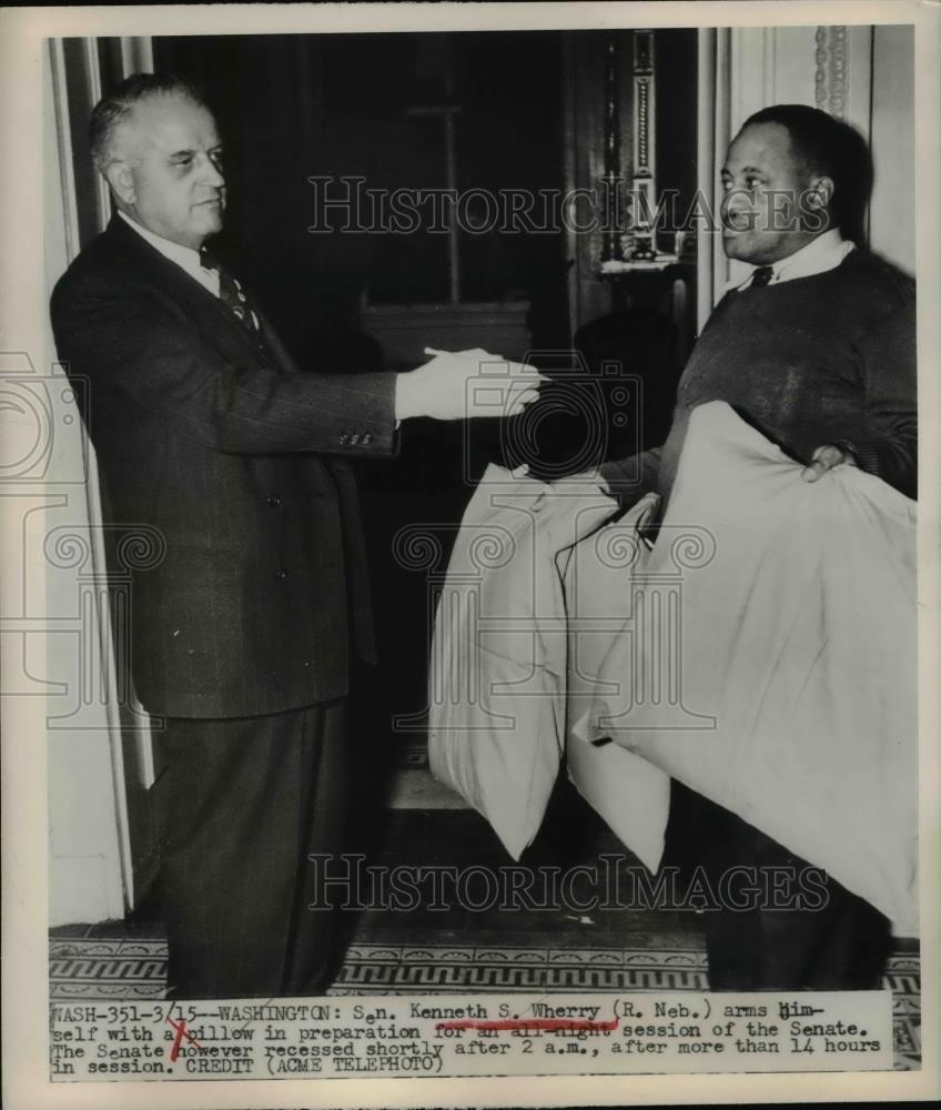 1949 Press Photo Den Hugh S Wherry arms himself with a pillow. - Historic Images