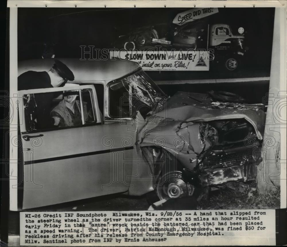 1956 Press Photo Milwaukee a hand that slipped from steering wheel caused this. - Historic Images