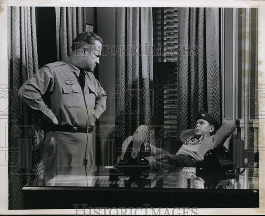 1953 Press Photo Pvt. Colonel Field seems to enjoy the Colonel R.L Clem's chair - Historic Images