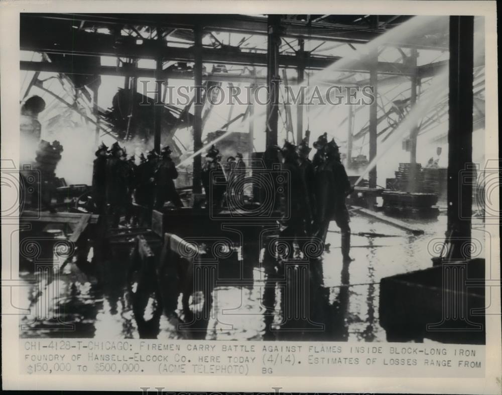 1948 Press Photo Firemen Battle against flame inside Block-long Iron Foundry. - Historic Images