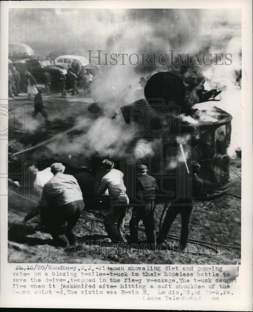 1949 Press Photo Fireman Shoveles during Woodbuy, NJ auto fire - Historic Images