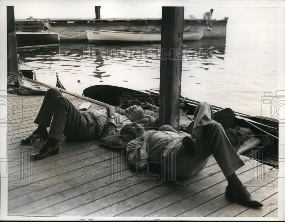 1938 Press Photo M.J McNamara and William Russell relax after feasting on bass - Historic Images