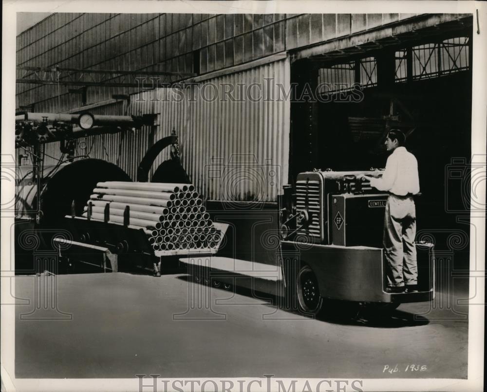 1951 Press Photo Power Trucks Carry Loads at Asbestos Pipe Plant - Historic Images