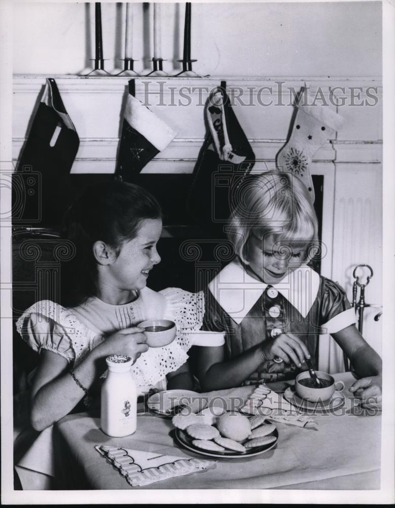 1957 Press Photo Girls Sip Cocoa &amp; Eat Cookies at Tea Party - Historic Images