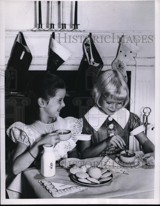 1957 Press Photo Girls Sip Cocoa & Eat Cookies at Tea Party - Historic Images