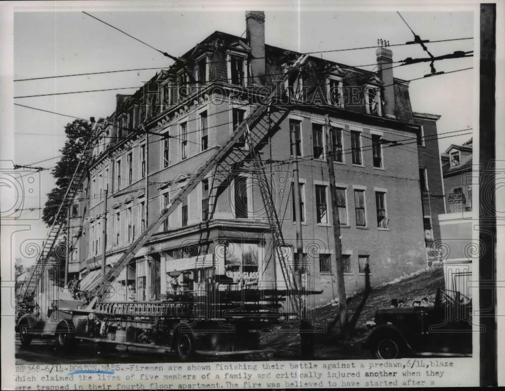 1962 Press Photo Firemen rescued member of the family from fire at Boston, Mass. - Historic Images