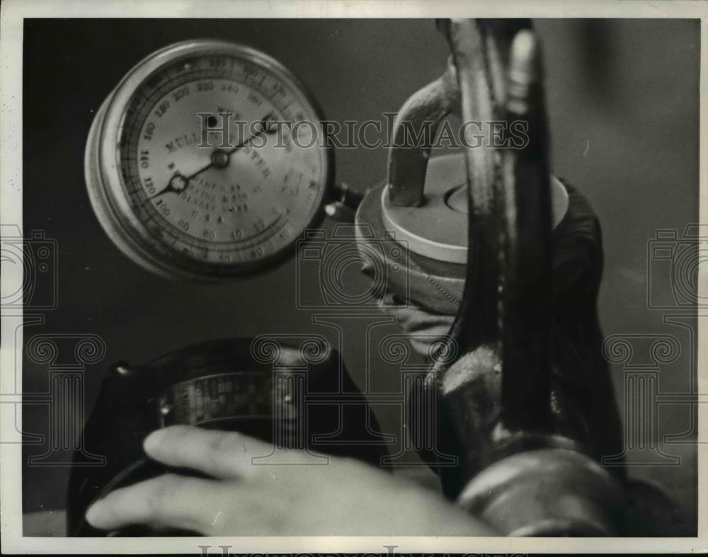 1937 Press Photo Dyed, Dried and Shaped stocking is given a machine test - Historic Images